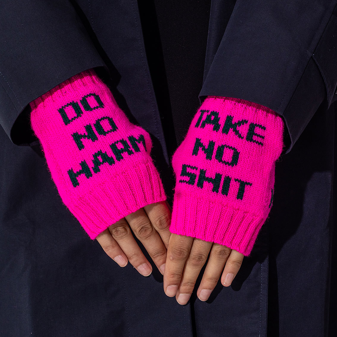 Do No Harm Take No Shit Wrist Warmers in Fluro Pink