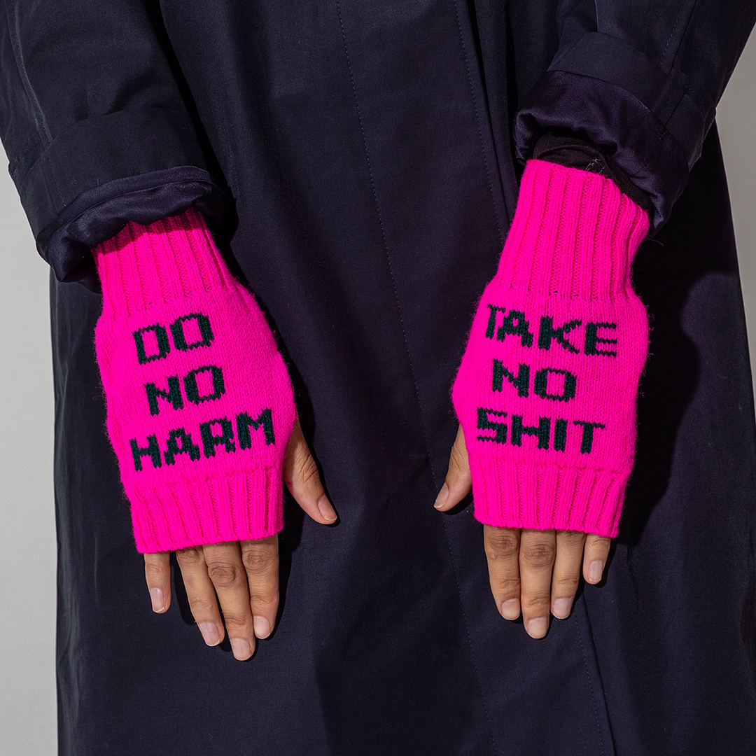 Do No Harm Take No Shit Wrist Warmers in Fluro Pink