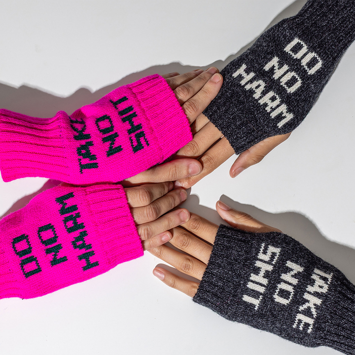 Do No Harm Take No Shit Wrist Warmers in Fluro Pink